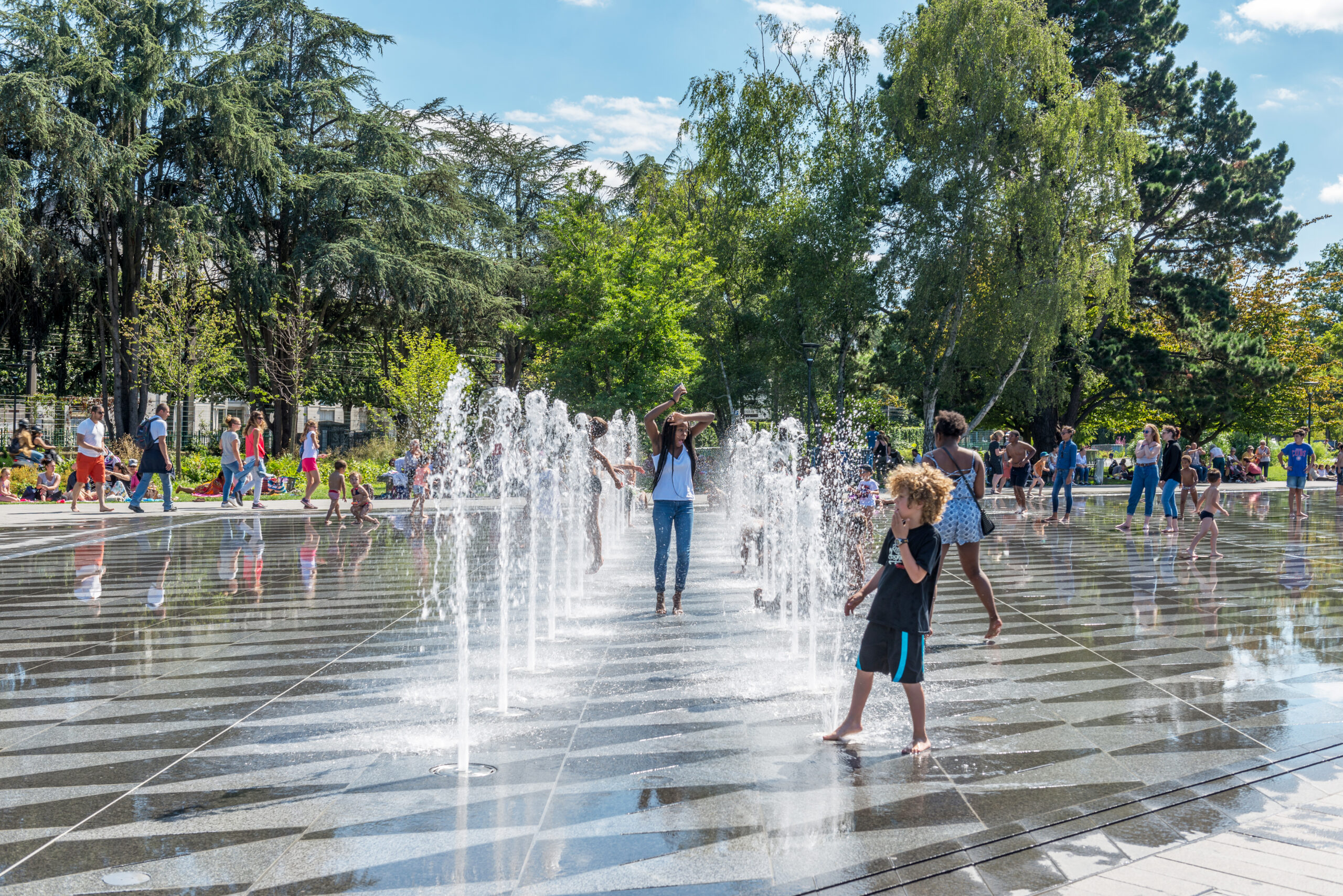 Children play in the fountain in front of the fortress in Nantes, France.